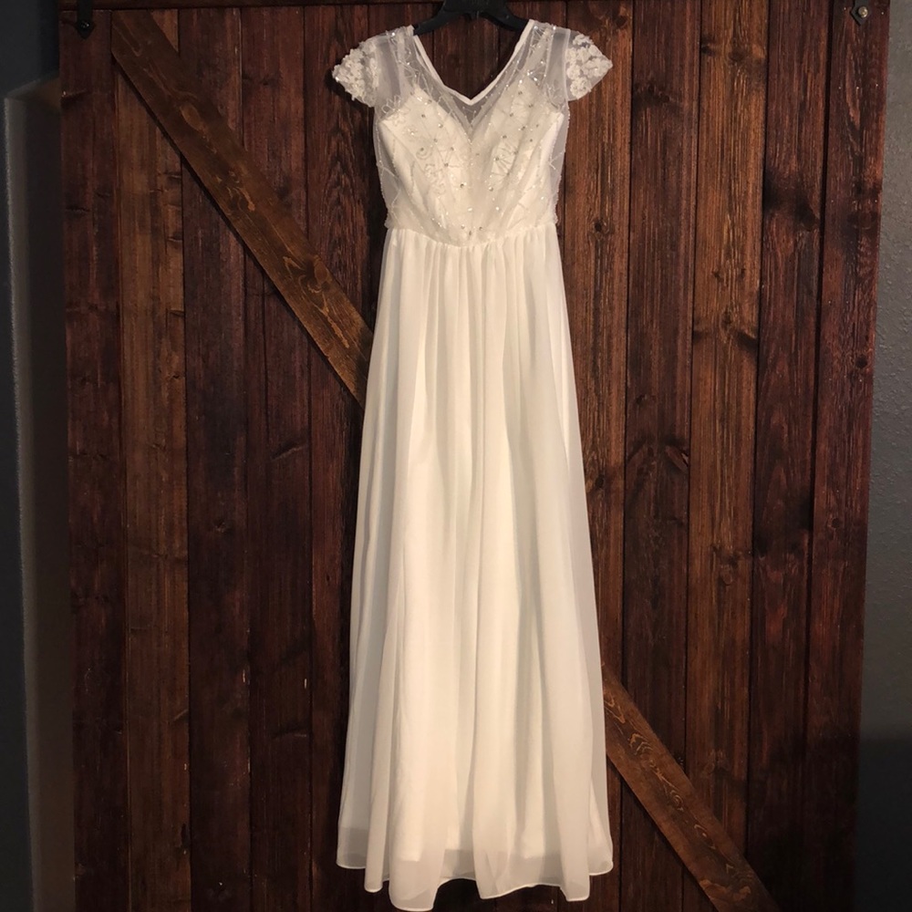 Beautiful hand beaded white formal gown